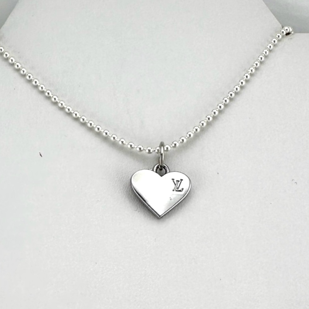 Louis Vuitton charm w/bonus gift. AUTHENTIC.